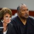 Defense attorney Patricia Palm, left, and O.J. Simpson appear at an evidentiary hearing in Clark County District Court on May 17, 2013 in Las Vegas. Simpson, who is currently serving a nine-to-33-year sentence in state prison as a result of his October 2008 conviction for armed robbery and kidnapping charges, is using a writ of habeas corpus to seek a new trial, claiming he had such bad representation that his conviction should be reversed.  (AP Photo/Ethan Miller, Pool)