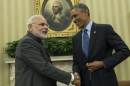 Indian Prime Minister Narendra Modi (L) and US President Barack Obama shake hands after a meeting in the Oval Office of the White House September 30, 2014