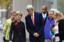 Secretary of State John Kerry, center, and Australian Foreign Minister Julie Bishop, second from left, stand at the site of the Boston Marathon bombings, Tuesday, Oct. 13, 2015, in Boston. Kerry and Secretary of Defense Ash Carter are meeting with their Australian counterparts in Boston to discuss security and trade issues. (AP Photo/Michael Dwyer)