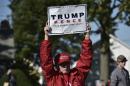 A supporter of Republican presidential nominee Donald Trump holds a placard during the 1st Congressional District Republican Party of Wisconsin Fall Fest, at the Walworth County Fairgrounds in Elkhorn, on October 8, 2016