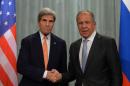 Russian Foreign Minister Sergei Lavrov (R) shakes hands with US Secretary of State John Kerry after their press conference in Moscow on July 15, 2016