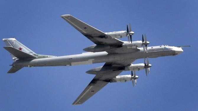 A Russian Tupolev Tu-95 turboprop-powered strategic bomber flies above the Kremlin in Moscow, on May 7, 2015, during a rehearsal for the Victory Day military parade