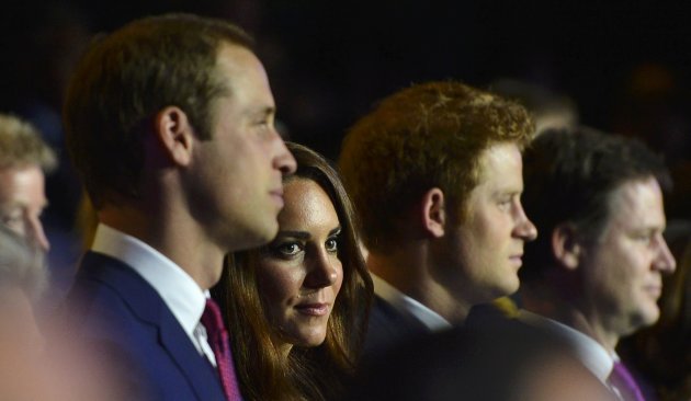 Britain's Prince William,  his wife Catherine, Duchess of Cambridge and Prince Harry watch the opening ceremony of the London 2012 Olympic Games at the Olympic Stadium