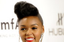 FILE - In this Wednesday, Feb. 8, 2012 file photo, singer Janelle Monae attends amfAR's New York gala benefit in New York. For the iTunes' Official Music Charts for the week ending Feb. 27, 2012, the top song was Fun's 