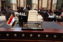 The empty seat of the Syrian President Bashar Assad is seen during the Arab League summit in Baghdad, Iraq, Thursday, March, 29, 2012. The annual Arab summit meeting opened in the Iraqi capital Baghdad on Thursday with only 10 of the leaders of the 22-member Arab League in attendance and amid a growing rift between Arab countries over how far they should go to end the one-year conflict in Syria. (AP Photo/Karim Kadim)