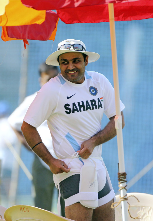 India&#39;s Virender Sehwag pads up during a training session ahead of their third test cricket match against West Indies in Mumbai, India, Sunday, Nov. 20, 2011. India won the first two tests. (AP Ph