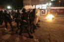 Riot police form up along a street during the "National Day of Strikes, Stoppages and Protests" in downtown of Rio de Janeiro