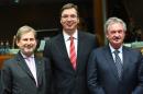 L-R: EU Commissioner Johannes Hahn, Serbia's Prime Minister Aleksandar Vucic, Luxembourg's Foreign Minister Jean Asselborn pose at an EU-Serbia association council meeting on December 14, 2015 at the European Council in Brussels