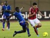 Gedo of Egypt's Al-Ahly fights for the ball with Yunusa of Nigeria's Sunshine Stars during their African Champions League semi-final soccer match at the Military Stadium in Cairo