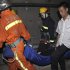 Rescue workers carry an injured passenger in the subway tunnel from a train involved in a collision in Shanghai on Tuesday Sept. 27, 2011.   A Shanghai subway train rear-ended another Tuesday, injuring more than 40 people in the latest trouble for the rapidly expanded transportation system in China's commercial center. (AP Photo) CHINA OUT