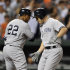 New York Yankees' Steve Pearce, right, celebrates his two-run home run against the Baltimore Orioles with Andruw Jones, who scored on the play, in the fourth inning of a baseball game Friday, Sept. 7, 2012, in Baltimore. (AP Photo/Gail Burton)