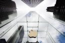 The Apple logo hangs in a glass enclosure above the 5th Ave Apple Store in New York