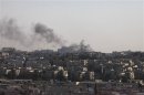 Smoke rises above Aleppo after a heavy jet strike on the city