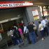 People queue outside an unemployment office in Madrid, Spain, Tuesday, July 3, 2012. The number of people claiming unemployment benefits in Spain went down sharply in June as employers embarked on a hiring spree to prepare for the country's busy summer tourism season. Spain's jobless rate is 52 percent for those under age 25. (AP Photo/Andres Kudacki)