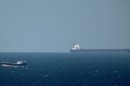 An oil tanker cruises towards the Strait of Hormuz off the shores of Khasab in Oman in January 2012