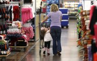 A woman shops with her daughter at a Walmart Supercenter in Rogers, Arkansas June 6, 2013. The annual shareholders meeting for Walmart takes place on June 7. REUTERS/Rick Wilking