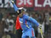 India's captain Sehwag celebrates after scoring 200 runs during their fourth one-day international cricket match against West Indies in Indore
