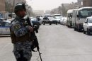 Iraqi security forces set up checkpoints on streets leading to the heavily fortified Green Zone in Baghdad on March 27