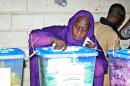 A woman casts her vote at the Ksar polling station in Nouakchott on November 23, 2013
