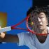 Wu Di of China hits a return to Ivan Dodig of Croatia during their men's single match at the Australian Open tennis tournament in Melbourne