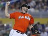 In this July 29, 2012, photo, Miami Marlins' Heath Bell pitches during a baseball game against the San Diego Padres in Miami. The Marlins traded Bell to the Arizona Diamondbacks on Saturday, Oct. 20, 2012. (AP Photo/Wilfredo Lee)