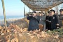North Korean leader Kim Jong-Un watches soldiers of the Korean People's Army (KPA) taking part in landing and anti-landing drills in the eastern sector of the front and the east coastal area
