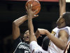 Minnesota's Ralph Sampson III (50) blocks the shot of Michigan State's Adreian Payne (5) as Minnesota's Rodney Williams, right, moves in on the play during the first half of an NCAA college basketball game, Wednesday, Feb. 22, 2012, in Minneapolis. (AP Photo/Tom Olmscheid)