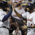 Detroit Tigers' Austin Jackson, right, celebrates with Prince Fielder after scoring on a single hit by Miguel Cabrera during the fifth inning of a baseball game against the Chicago White Sox in Chicago, Wednesday, Sept. 12, 2012. (AP Photo/Nam Y. Huh)