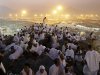 Muslim pilgrims pray on a rocky hill called the Mountain of Mercy, on the Plain of Arafat near the holy city of Mecca, Saudi Arabia, in the early hours of Thursday, Oct. 25, 2012. Saudi authorities say around 3.4 million pilgrims — some 1.7 million of them from abroad — have arrived in the holy cities of Mecca and Medina for this year's pilgrimage. (AP Photo/Hassan Ammar)