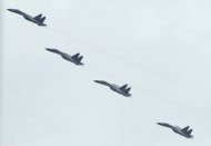 Chinese fighter jets are seen flying in formation over Beijing. A news website run by China's defence ministry said Thursday the nation's aircraft carrier should handle territorial disputes, despite government assurances the vessel posed no threat to its neighbours