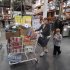 Jenni Weber and her son Jacob, 7, of Portland, shops at a Costco store Wednesday, Dec. 7, 2011, in, Portland, Ore. Costco Wholesale Corp. said Thursday, Dec. 8, 2011, its fiscal first-quarter profit rose 2.6 percent percent as shoppers spent more on gasoline and the company benefited from currency exchange rates. (AP Photo/Rick Bowmer)