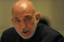 Afghan President Hamid Karzai addresses media representatives during a press interaction in New Delhi on December 14, 2013