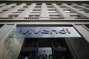 A logo of entertainment-to-telecoms conglomerate Vivendi is seen on the main entrance of the company's headquarters in Paris July 23, 2013. REUTERS/Christian Hartmann