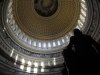A statue of the United States first President, George Washington, is seen under the Capitol dome in Washington