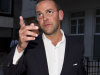 FILE - This is a  Sunday July 10, 2011 photo of the then Chief executive of News Corporation Europe and Asia, James Murdoch gesturing as he leaves his father Chairman of News Corporation Rupert Murdoch's residence, in central London. James Murdoch said Wednesday March 14, 2012  'I could have asked more questions' about phone hacking at News International.  (AP Photo/Sang Tan, File)