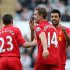 Liverpool's Jordan Henderson, center, celebrates his goal with his teammates during their English Premier League soccer match against Newcastle United at St James' Park, Newcastle, England, Saturday, April 27, 2013. (AP Photo/Scott Heppell)