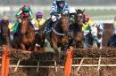 Whisper ridden by Nico de Boinville, centre, jumps clear to go on to win the Coral Cup during day two of the Cheltenham Festival at Cheltenham Racecourse, Cheltenham England Wednesday March 12, 2014. (AP Photo/David Davies/PA) UNITED KINGDOM OUT