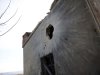 A house hit by a shell in Idlib, northwest Syria, which activists said Wednesday was fired by Syrian regime forces