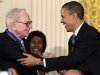 FILE - In this Feb. 15, 2010, file photo President Barack Obama congratulates Warren Buffett after presenting him with a 2010 Presidential Medal of Freedom in an East Room ceremony at the White House in Washington. In his weekly radio and internet address Saturday April 14, 2012, Obama urged Americans to ask their member of Congress to support the "Buffett Rule," named after the billionaire investor who says he pays a lower tax rate than his secretary. Obama says the nation can't afford to keep giving tax cuts to the wealthiest, "who don't need them and didn't even ask for them." (AP Photo/Carolyn Kaster)