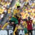 South Africa's Furman jumps for the ball against Angola's Manucho during their African Nations Cup Group A soccer match at the Moses Mabhida stadium in Durban
