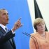 U.S. President Obama speaks next to German Chancellor Merkel during news conference at Chancellery in Berlin
