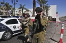 Israeli soldiers secure the area near the site of a shooting incident at a hotel in the Red Sea resort town of Eilat, Israel, Friday, Oct. 5, 2012. A young American opened fire in a hotel in Eilat Friday, killing one person before police shot him dead in an incident that appeared to be a personal dispute. (AP Photo/Eliraz Getah) ISRAEL OUT