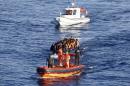 File photo of a Turkish Coast Guard fast rigid-hulled inflatable boat tows a dinghy filled with refugees and migrants in the Turkish territorial waters of the North Aegean Sea