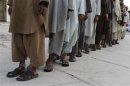 Prisoners who escaped from Kandahar's Sarposa jail on Monday are presented to the media after they were recaptured, in Kandahar