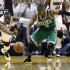 Miami Heat's Wade fights for a loose ball with Boston Celtics' Rondo in the third quarter during Game 7 of their Eastern Conference Finals NBA basketball playoffs in Miami
