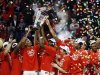 Ohio State players celebrate after winning an NCAA college basketball game against Wisconsin in the championship of the Big Ten tournament Sunday, March 17, 2013, in Chicago. Ohio State won 50-43. (AP Photo/Charles Rex Arbogast)