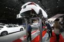 A Lexus IS 250 is seen on an elevated display at the New York International Auto Show in New York City
