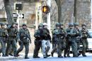Police respond to the reports of a gunman on Yale campus Monday, Nov. 25, 2013, in New Haven, Conn. A lockdown remained in effect on the Old Campus Monday afternoon as police search rooms to confirm that no gunman is on campus. (AP Photo/New Haven Register, Arnold Gold)