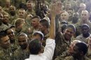 President Barack Obama gets a high five as he greets troops at Bagram Air Field, Afghanistan, Wednesday, May 2, 2012. (AP Photo/Charles Dharapak)