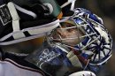 Columbus Blue Jackets goalie Bobrovsky squirts water on his face during NHL hockey in Vancouver